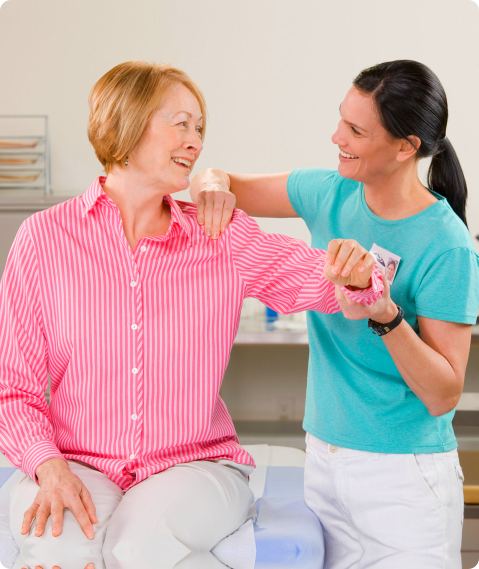 caregiver giving a shoulder massage to patient